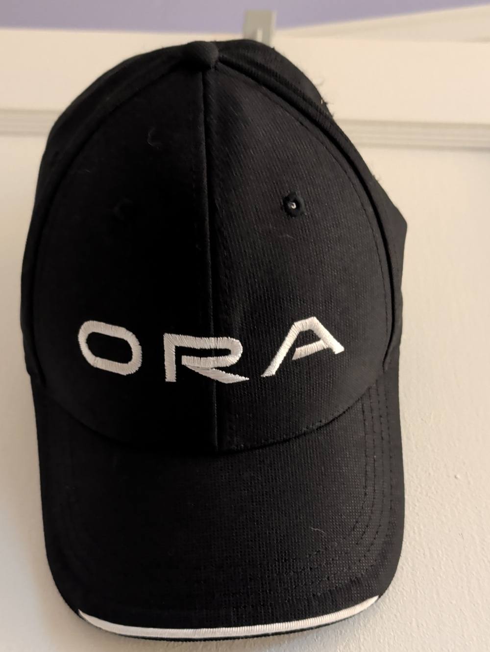 Black Baseball Cap with White Embroidered Logo ORA